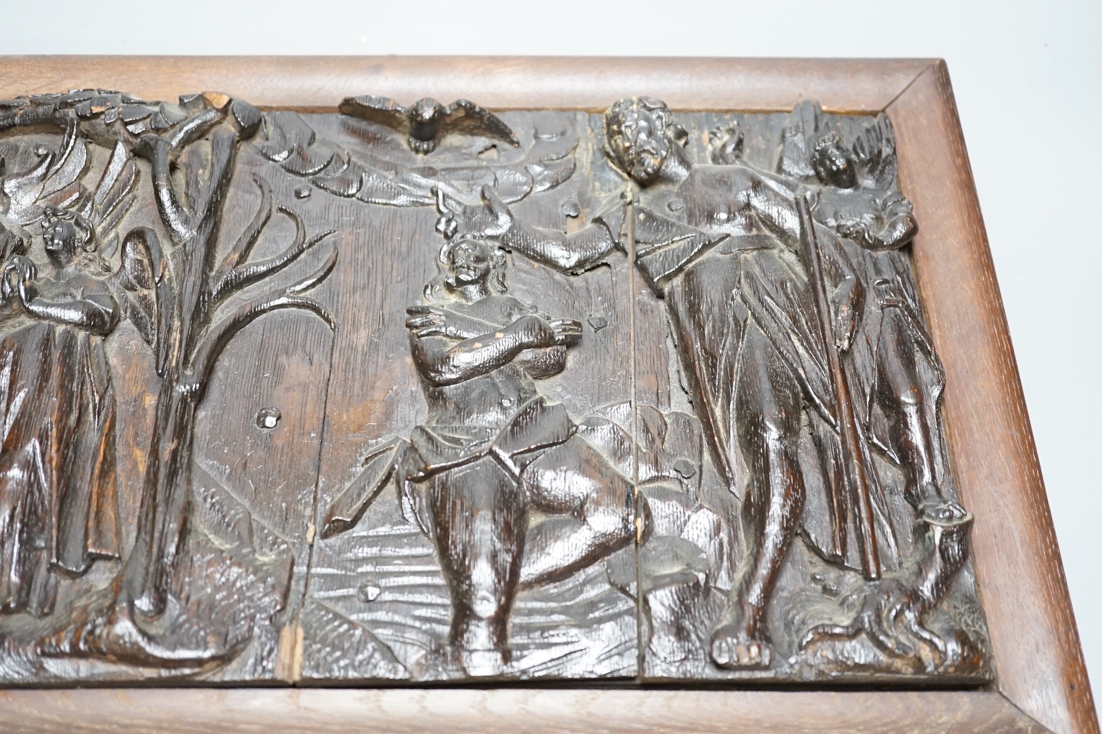 An antique rectangular carved oak panel, later frame, 25x40cm excl frame